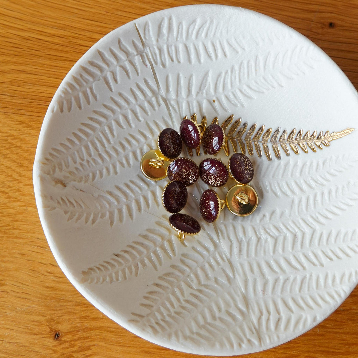 Bouton de bottine pailletté or - Lie de Vin